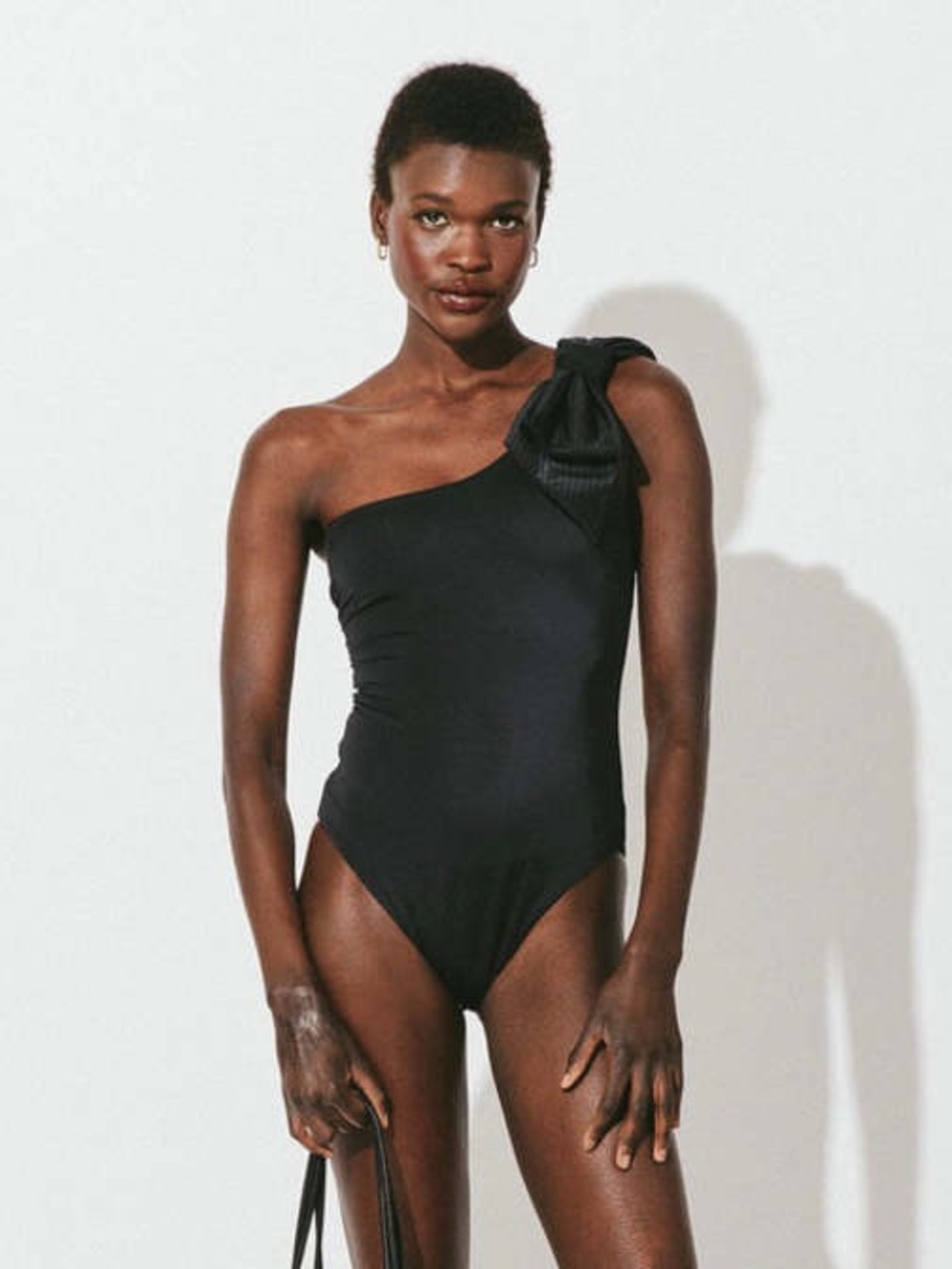 CLEOBELLA One Shoulder Black Bow One Piece Swimsuit Sz Small NWT
